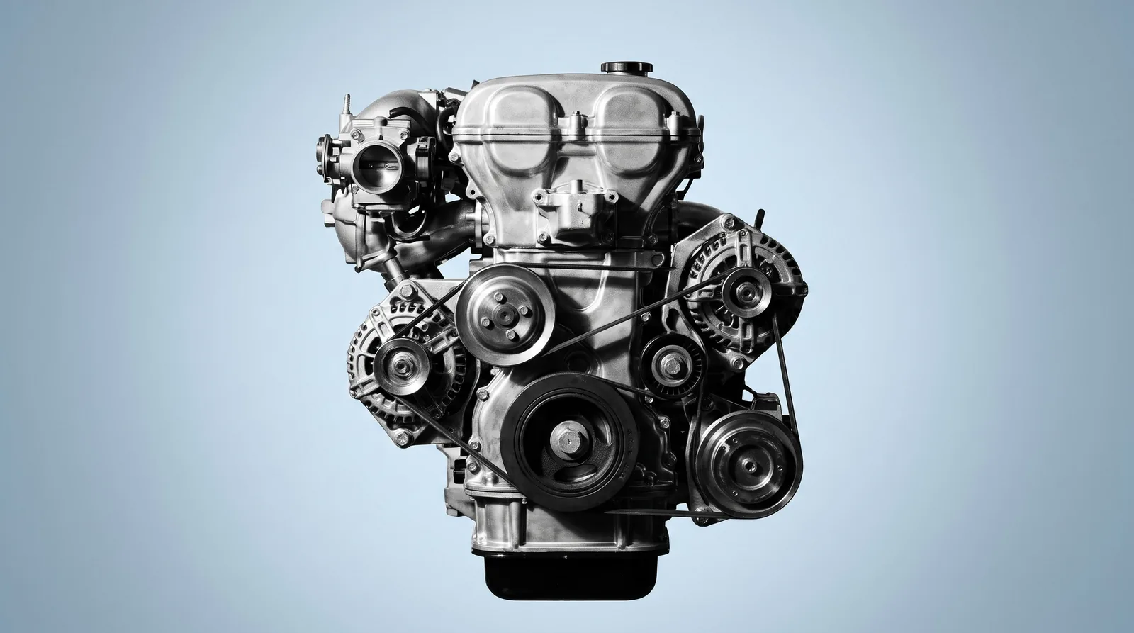 Reconditioned Hyundai petrol engine photographed from the front showing pulleys and accessory belt